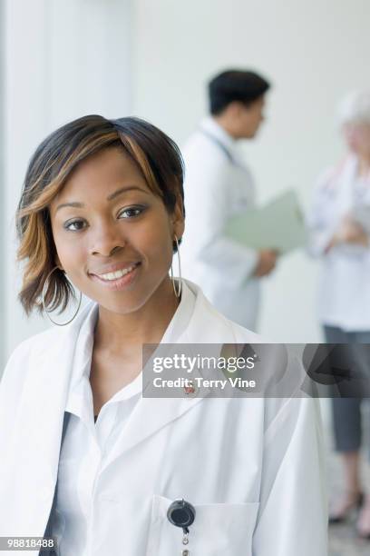 black doctor in lab coat - terry fair stock pictures, royalty-free photos & images