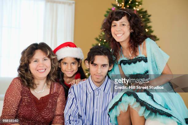 hispanic family smiling at christmas - gardena california stock pictures, royalty-free photos & images