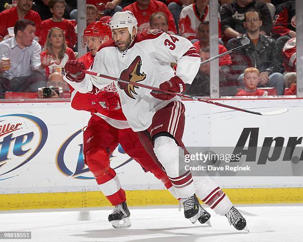 Daniel Winnik of the Phoenix Coyotes skates in front of Nicklas Lidstrom of the Detroit Red Wings during Game Six of the Western Conference...