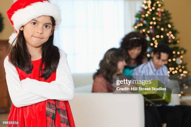 hispanic girl in santa hat with family - gardena california stock pictures, royalty-free photos & images