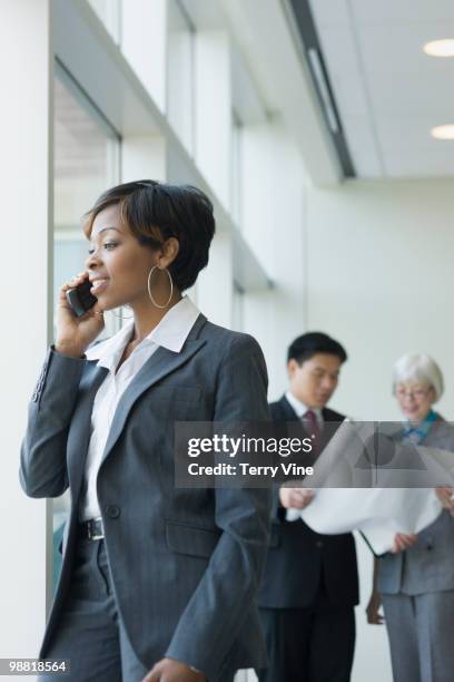 black businesswoman talking on cell phone - terry fair stock pictures, royalty-free photos & images