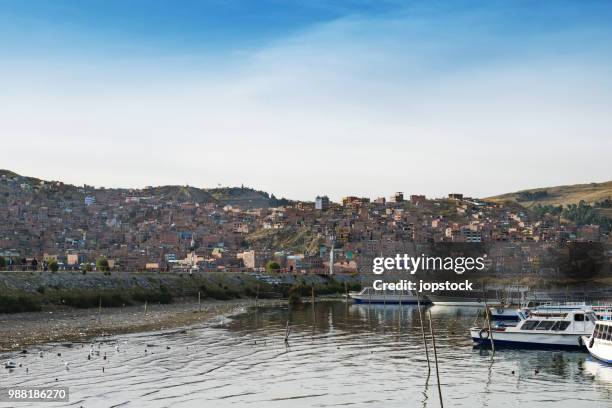 skyline of puno city and titikaka lake - los andes puno stock pictures, royalty-free photos & images