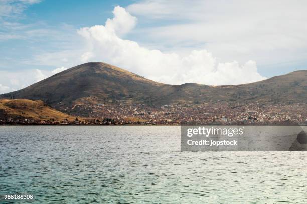 skyline of puno city and titikaka lake - los andes puno stock pictures, royalty-free photos & images