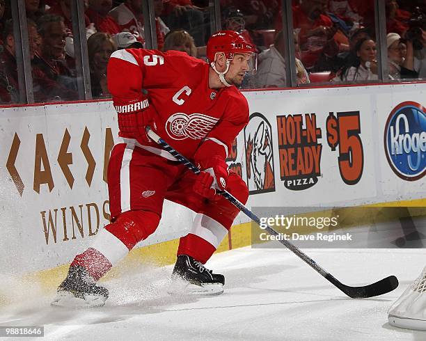 Nicklas Lidstrom of the Detroit Red Wings stops behind the net with the puck during Game Six of the Western Conference Quarterfinals of the 2010 NHL...