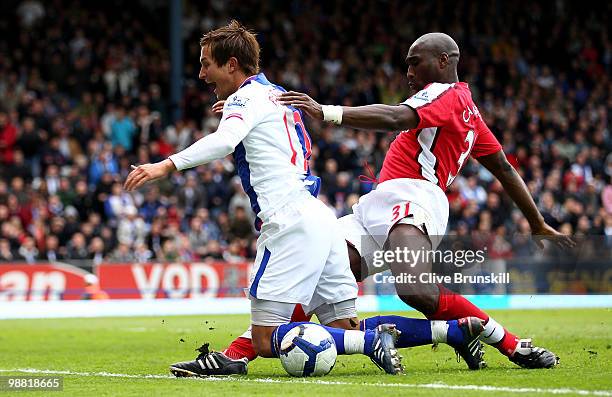 Sol Campbell of Arsenal fouls Morten Gamst Pedersen of Blackburn Rovers in the penalty box during the Barclays Premier League match between Blackburn...