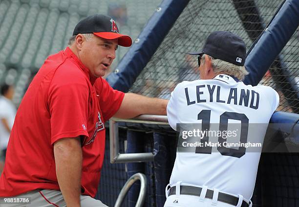 Manager Mike Scioscia of the Los Angeles Angels of Anaheim talks with manager Jim Leyland of the Detroit Tigers before the game at Comerica Park on...