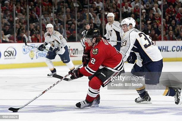 Duncan Keith of the Chicago Blackhawks takes control of the puck as Colin Wilson of the Nashville Predators comes up from behind at Game Two of the...