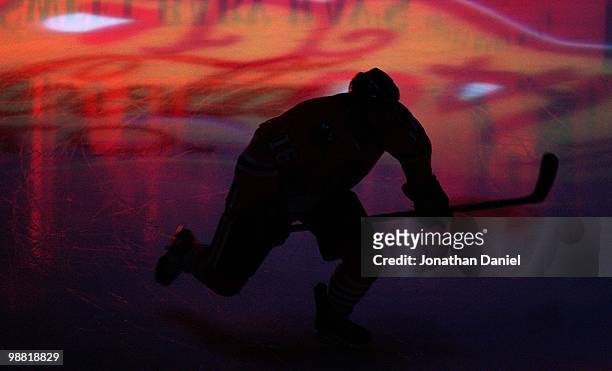 Andrew Ladd of the Chicago Blackhawks skates onto the ice during player introductions before the Blackhawks take on the Vancouver Canucks in Game One...