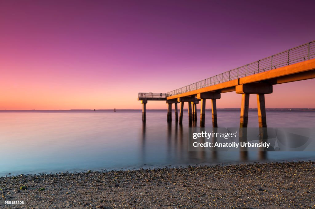 Fishing pier on Raritan Bay at sunset, Staten Island, New York City, USA