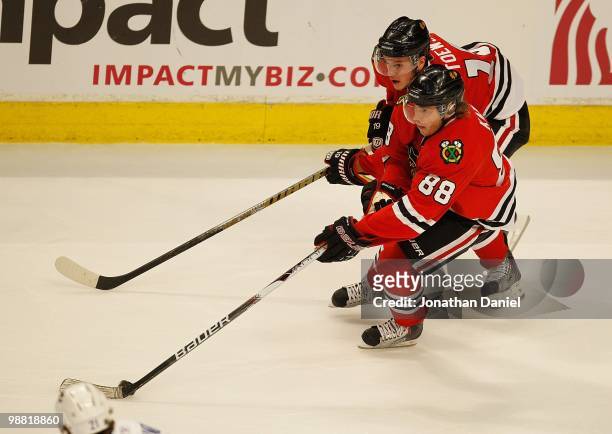 Jonathan Toews and Patrick Kane of the Chicago Blackhawks skate up the ice against the Vancouver Canucks in Game One of the Western Conference...