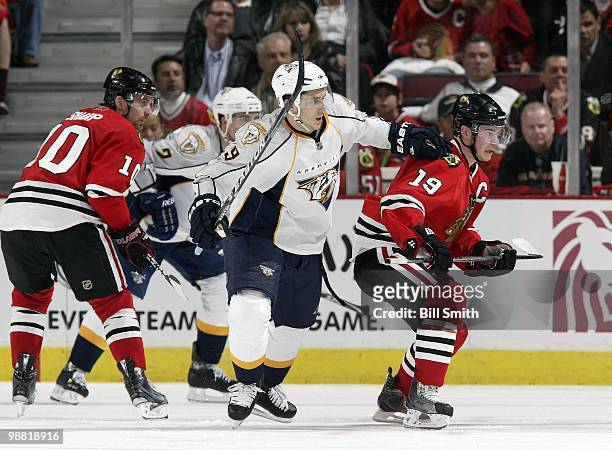 Marcel Goc of the Nashville Predators and Jonathan Toews of the Chicago Blackhawks watch for the puck at Game Two of the Western Conference...
