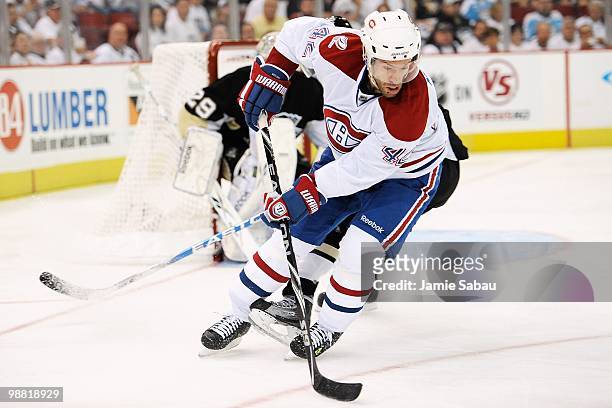 Dominic Moore of the Montreal Canadiens skates with the puck against the Pittsburgh Penguins in Game One of the Eastern Conference Semifinals during...