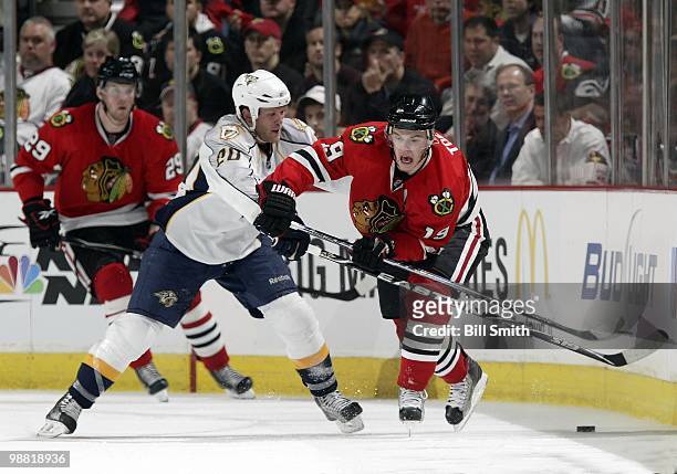 Ryan Suter of the Nashville Predators pushes into Jonathan Toews of the Chicago Blackhawks at Game Two of the Western Conference Quarterfinals during...