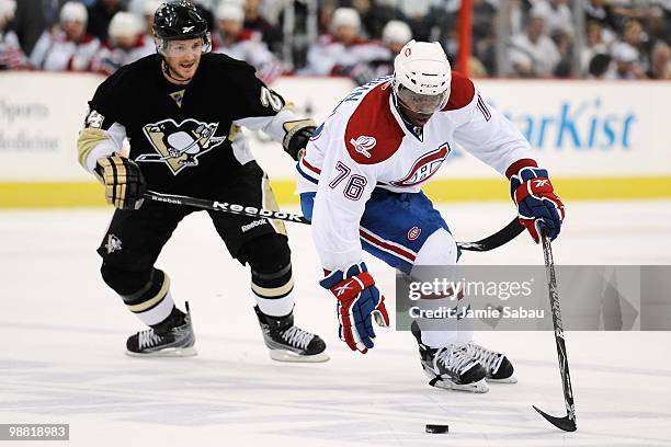 Subban of the Montreal Canadiens controls the puck as Matt Cooke of the Pittsburgh Penguins defends in Game One of the Eastern Conference Semifinals...