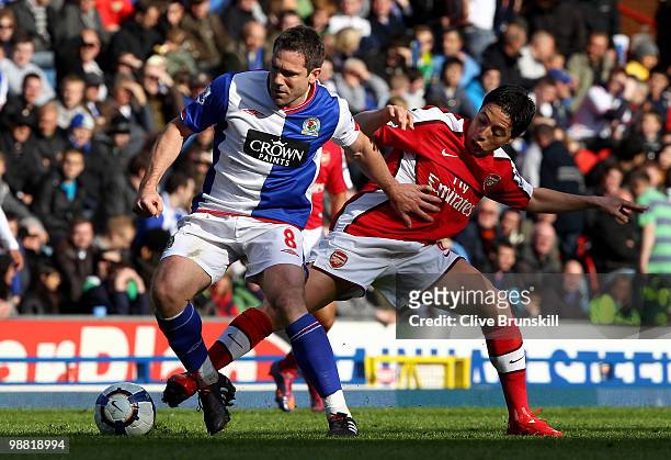 David Dunn of Blackburn Rovers holds off a challenge from Samir Nasri of Arsenal during the Barclays Premier League match between Blackburn Rovers...