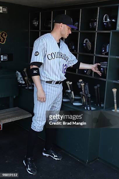 Clint Barmes of the Colorado Rockies gets ready in the dugout before the game between the Colorado Rockies and the San Francisco Giants on Sunday,...