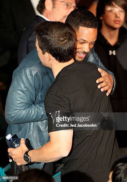 Actor Mark Wahlberg talks with actor Will Smith before the start of the Floyd Mayweather Jr. And Shane Mosley welterweight fight at the MGM Grand...