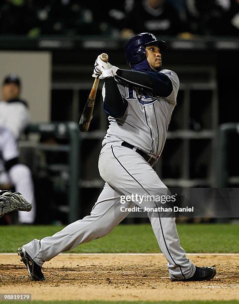 Dioner Navarro of the Tampa Bay Rays takes a swing against the Chicago White Sox at U.S. Cellular Field on April 21, 2010 in Chicago, Illinois. The...