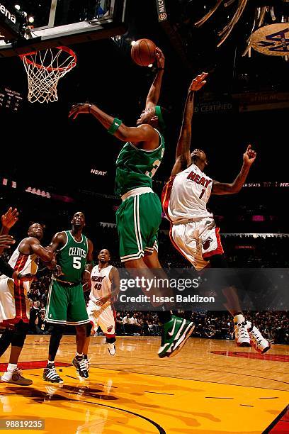 Paul Pierce of the Boston Celtics slam dunks past Dorell Wright of the Miami Heat in Game Three of the Eastern Conference Quarterfinals during the...