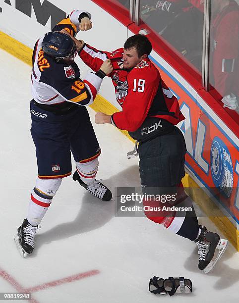 Matt Stanisz of the Barrie Colts battles with Zack Kassian of the Windsor Spitfires in the third game of the OHL Championship final on May 2,2010 at...