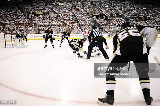 Craig Adams of the Pittsburgh Penguins takes a face off against the Montreal Canadiens in Game One of the Eastern Conference Semifinals during the...
