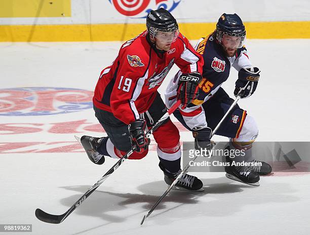 Matt Kennedy of the Barrie Colts tries to hold up Zack Kassian of the Windsor Spitfires in the third game of the OHL Championship final on May 2,2010...