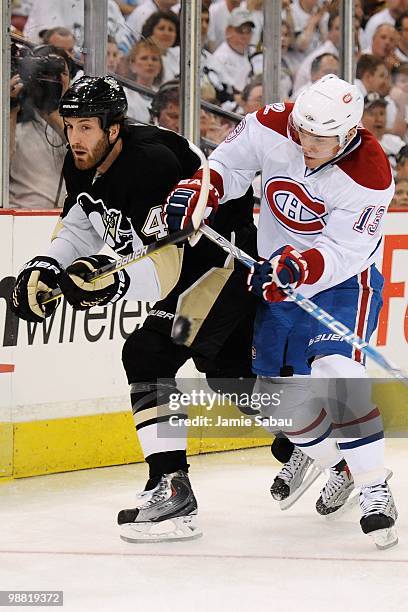 Brooks Orpik of the Pittsburgh Penguins is checked by Michael Cammalleri of the Montreal Canadiens in Game One of the Eastern Conference Semifinals...