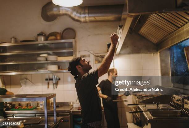 taking orders - greek chef stock pictures, royalty-free photos & images