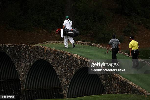 Tiger Woods and K.J. Choi walk to the 12th green during the first round of the 2010 Masters Tournament at Augusta National Golf Club on April 8, 2010...