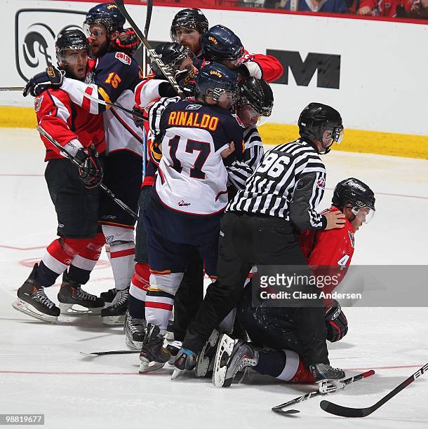 Zac Rinaldo of the Barrie Colts roughs up Taylor Hall of the Windsor Spitfires in the third game of the OHL Championship final on May 2,2010 at the...
