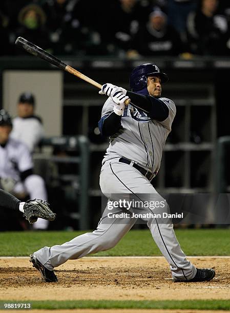 Dioner Navarro of the Tampa Bay Rays takes a swing against the Chicago White Sox at U.S. Cellular Field on April 21, 2010 in Chicago, Illinois. The...