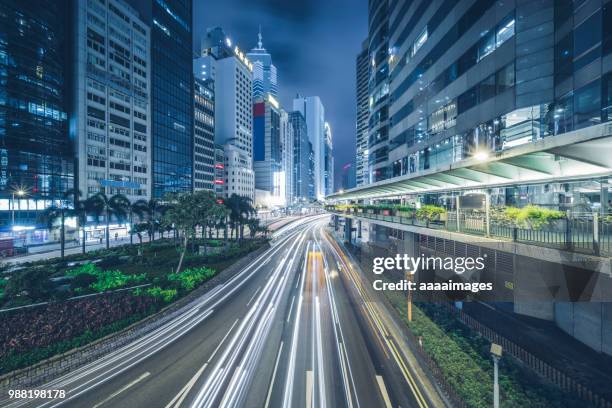 downtown cityscape at night of hong kong - in central stock pictures, royalty-free photos & images