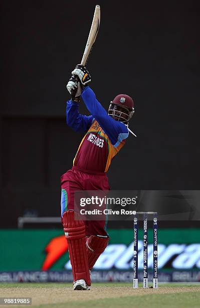 Chris Gayle of West Indies hits a six during the ICC T20 World Cup Group D match between West Indies and England at the Guyana National Stadium...