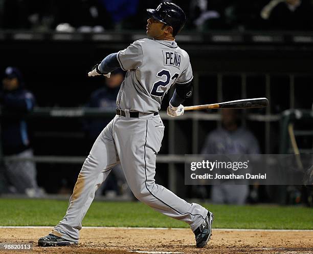 Carlos Pena of the Tampa Bay Rays hits the ball against the Chicago White Sox at U.S. Cellular Field on April 21, 2010 in Chicago, Illinois. The Rays...