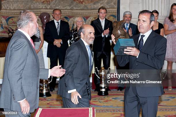 King Juan Carlos of Spain presents a Lifetime Achievement Award to Severiano Ballesteros at the 'National sports awards 2009' at Palacio Real on May...