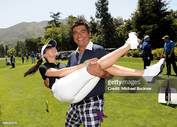 Comedian George Lopez picks up actress Aimee Garcia before teeing off at the 3rd Annual George Lopez Celebrity Golf Classic at the Lakeside Golf Club...