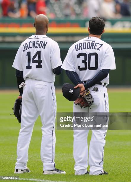 Austin Jackson and Magglio Ordonez of the Detroit Tigers stand together during the National Anthem before the game against the Los Angeles Angels of...