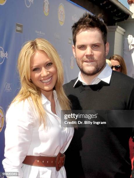 Actress/singer Hilary Duff and hockey player Mike Comrie arrive at the Third Annual George Lopez Celebrity Golf Classic at the Lakeside Golf Club on...