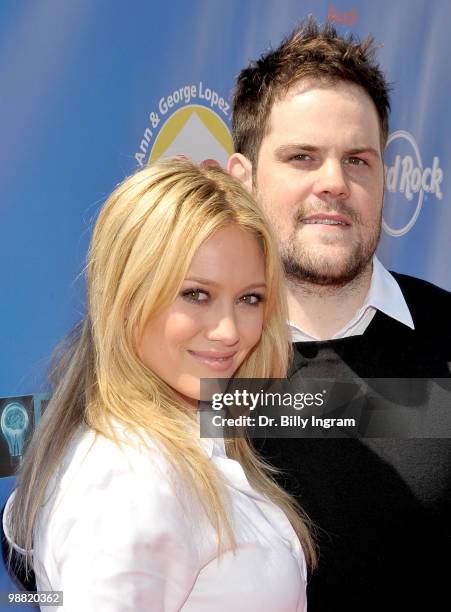 Actress/singer Hilary Duff and hockey player Mike Comrie arrive at the Third Annual George Lopez Celebrity Golf Classic at the Lakeside Golf Club on...