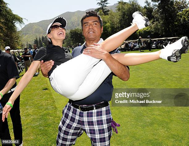 Comedian George Lopez picks up actress Aimee Garcia before teeing off at the 3rd Annual George Lopez Celebrity Golf Classic at the Lakeside Golf Club...