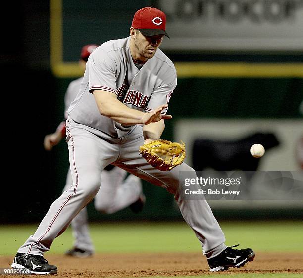 Third baseman Scott Rolen of the Cincinnati Reds fields the ball against the Houston Astros at Minute Maid Park on April 29, 2010 in Houston, Texas.