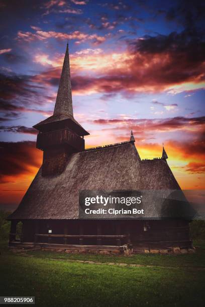 old wooden church against colorful sunset sky - ciprian stock pictures, royalty-free photos & images