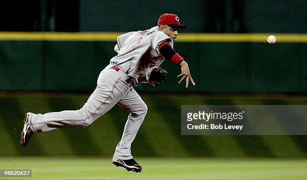 Shortstop Orlando Cabrera of the Cincinnati Reds flips the ball to second baseman Brandon Phillips against the Houston Astros at Minute Maid Park on...