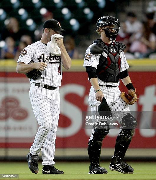 Pitcher Roy Oswalt and catcher J.R. Towles of the Houston Astros make their way in from the bullpen before a baseball game against the Cincinnati...