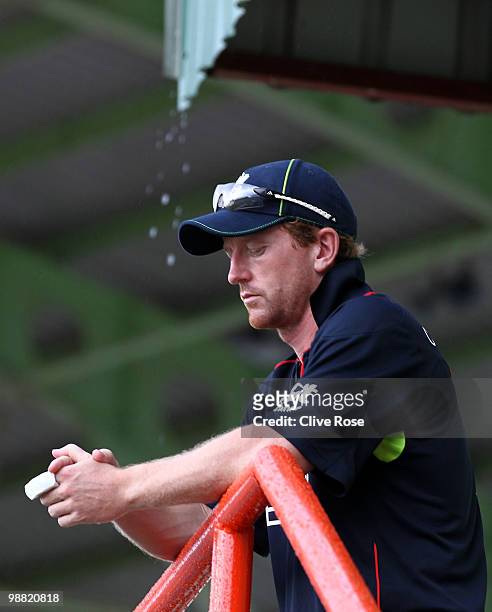 Paul Collingwood of England looks on as the rain comes down during the ICC T20 World Cup Group D match between West Indies and England at the Guyana...