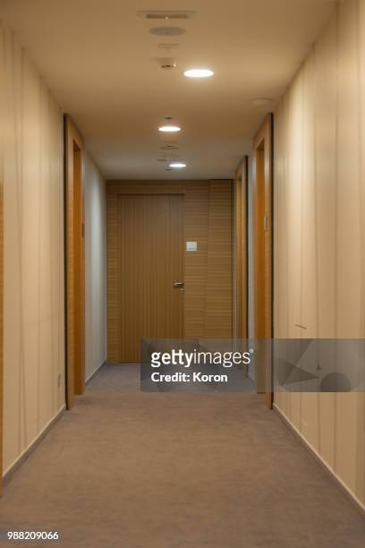 hotel corridor - apartment corridor stock pictures, royalty-free photos & images