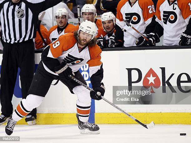 Scott Hartnell of the Philadelphia Flyers takes the puck in the overtime period against the Boston Bruins in Game One of the Eastern Conference...