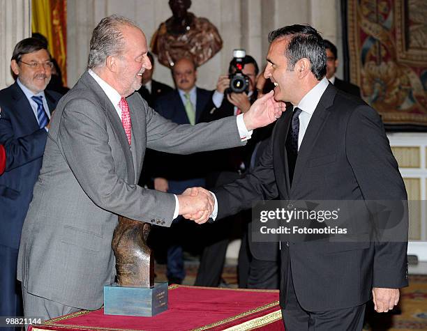 King Juan Carlos of Spain delivers a lifetime achievement award to former golf player Severiano Ballesteros, during the 'National Sports Awards' 2009...