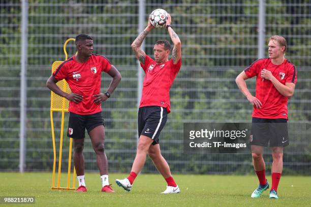 Sergio Cordova of Augsburg, Julian Schieber of Augsburg and Fredrik Jensen of Augsburg look on during a FC Augsburg Training session on June 28, 2018...