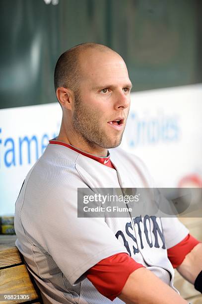 Dustin Pedroia of the Boston Red Sox sits in the dugout before the game against the Baltimore Orioles at Camden Yards on April 30, 2010 in Baltimore,...